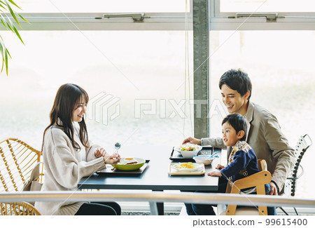 family eating out at a restaurant 99615400