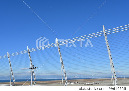 Wire fence on the sky deck of Chubu Centrair International Airport Wire fence on the sky deck of Chubu Centrair International Airport 99616536