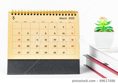 The Brown March 2023 Monthly desk calendar for 2023 year with the books on white background. The Brown March 2023 Monthly desk calendar for 2023 year with the books on white background. 99617886