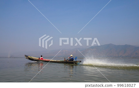 Wooden boat on Inle Lake, Myanmar 99618027