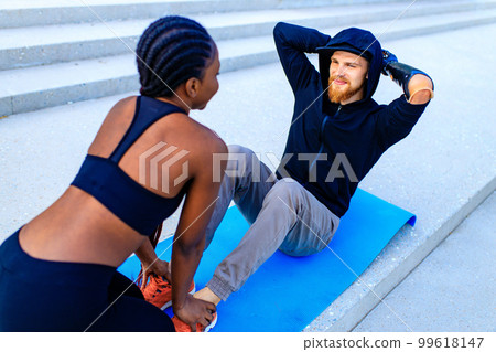 mixed race friends fitness training together outdoors summer morning mixed race friends fitness training together outdoors summer morning 99618147