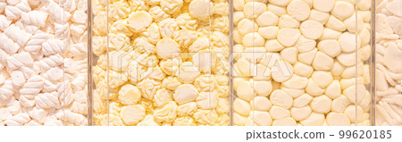 Pastel yellow marshmallows in a shop window 99620185