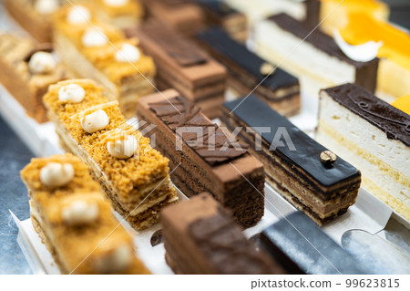 various delicious sweet pastries in the shop window. various delicious sweet pastries in the shop window. 99623815