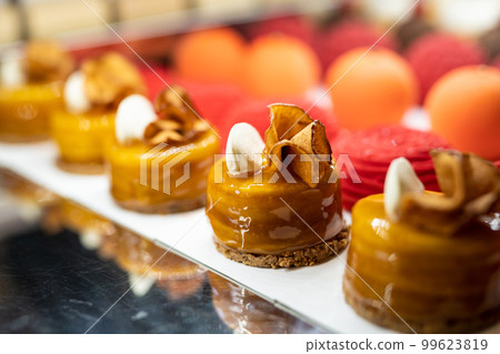 various delicious sweet pastries in the shop window. various delicious sweet pastries in the shop window. 99623819