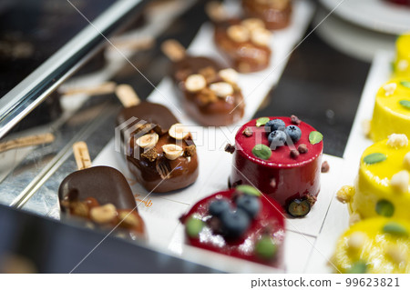 various delicious sweet pastries in the shop window. various delicious sweet pastries in the shop window. 99623821