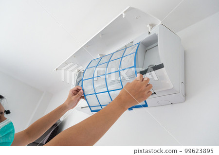 man hand hold air conditioner filter cleaning concept 99623895