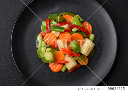 Delicious juicy broccoli vegetables, carrots, asparagus beans and bell peppers 99624335