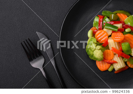 Delicious juicy broccoli vegetables, carrots, asparagus beans and bell peppers Delicious juicy broccoli vegetables, carrots, asparagus beans and bell peppers 99624336
