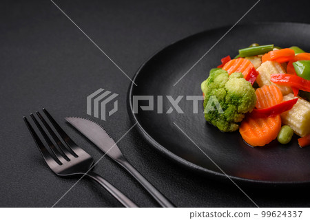 Delicious juicy broccoli vegetables, carrots, asparagus beans and bell peppers Delicious juicy broccoli vegetables, carrots, asparagus beans and bell peppers 99624337