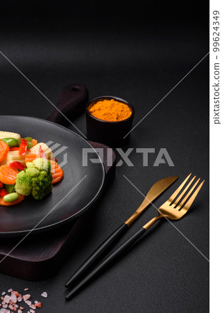 Delicious juicy broccoli vegetables, carrots, asparagus beans and bell peppers 99624349