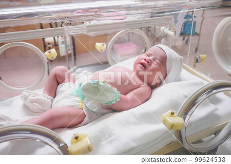 new born baby infant sleep in the incubator at hospital 99624538