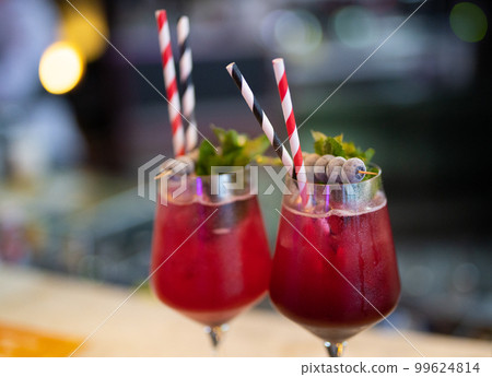 beautiful and delicious alcoholic cocktails prepared at the bar by the bartender. beautiful and delicious alcoholic cocktails prepared at the bar by the bartender. 99624814