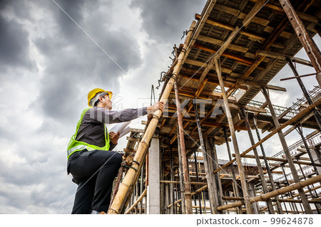 professional engineer worker at the house building construction site 99624878