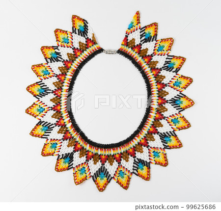 handmade colorful bead necklace close-up isolated on white background. handmade colorful bead necklace close-up isolated on white background. 99625686