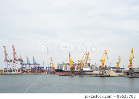seaport where large cranes are loaded containers on cargo ships seaport where large cranes are loaded containers on cargo ships 99625708