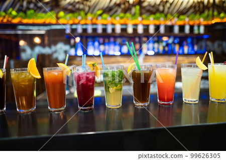 many different cocktails prepared by at the bar 99626305