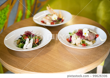 close up of a beautiful gourmet serving of a delicious meal in a restaurant 99626306