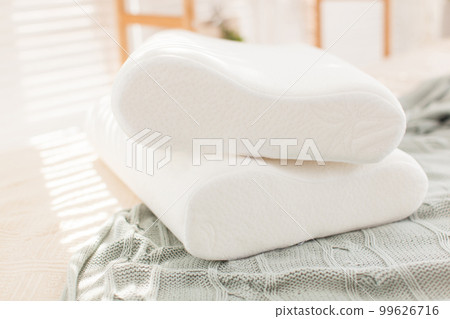 beautiful interior photographs of the modern bedroom, comfortable pillows of orthopedic 99626716