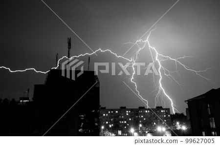beautiful big lightning during a thunderstorm in the city. 99627005