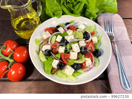 Greek salad with fresh vegetables closeup Greek salad with fresh vegetables closeup 99627230