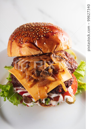 Tasty and appetizing hamburger cheeseburger. High quality photo Tasty and appetizing hamburger cheeseburger. High quality photo 99627340