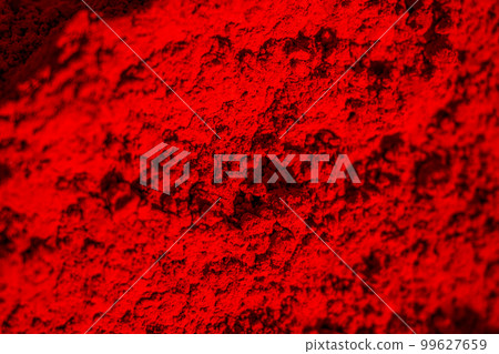 Close-up of organic deep red colored Sindoor or kumkum as background. Herbal gulal or Holi colors. Selective focus. 99627659