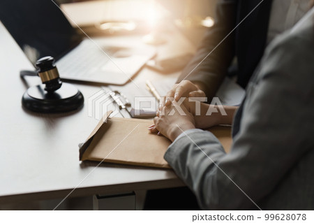 Close up of business person and lawyers discussing agreement contract in office. Law, legal services, advice, Justice concept Close up of business person and lawyers discussing agreement contract in office. Law, legal services, advice, Justice concept 99628078