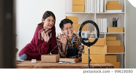 Asian couple doing business online. Entrepreneurs, small SME businesses concept. 99628080