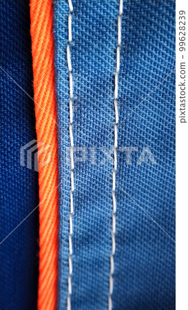 Blue work uniform clothes with an orange stripe macro 99628239