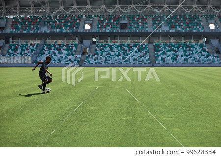 Professional football player in action at the stadium. Professional football player in action at the stadium. 99628334