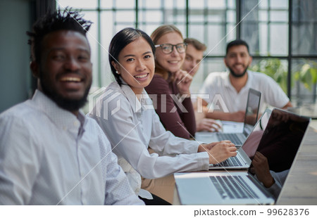 Multiethnic business people working together in the office 99628376