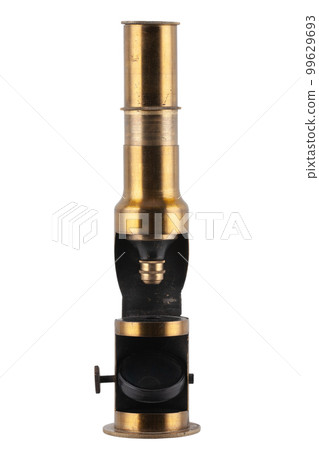 Vintage brass microscope. Small hand microscope from the 20th century. Vintage brass microscope. Small hand microscope from the 20th century. 99629693