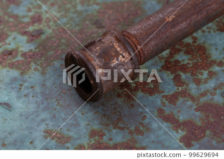 Rusty valve pipes on rusty metal wall Rusty valve pipes on rusty metal wall 99629694