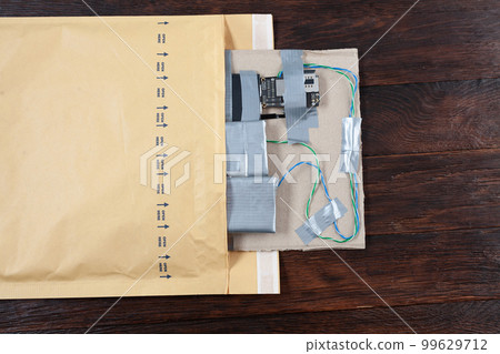 Mail bomb IED - Improvised Explosive Device with c4 and cell phone module in envelope Mail bomb IED - Improvised Explosive Device with c4 and cell phone module in envelope 99629712