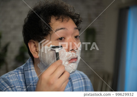 man changing from pajamas man changing from pajamas 99629932