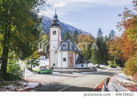 Church between the Alpine Range and Lake Bohinj in Slovenia Church between the Alpine Range and Lake Bohinj in Slovenia 99630602