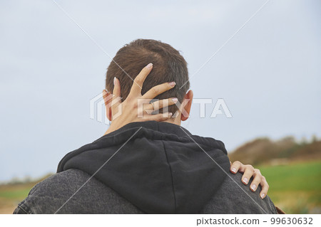 Newlyweds kissing on the beach in Denmark 99630632
