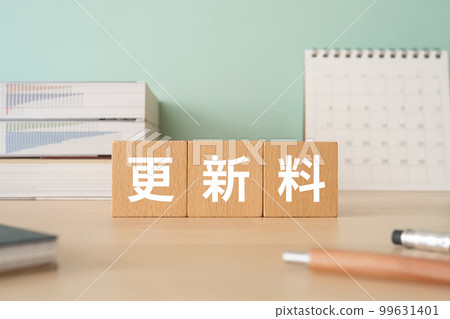 A desk with a block that says Renewal Fee 99631401