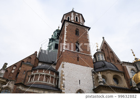 Royal Wawel royal castle in Krakow in rainy early spring weather in Poland. historic castle in the old city Gardens and cathedra, Cracow, Poland. Travel attraction 99632882