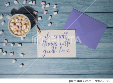 DO SMALL THINGS WITH GREAT LOVE text inscription positive quote, motivation and inspiration phrase. Greeting card with white cup of coffee and marshmallows on wooden blue background. holiday concept DO SMALL THINGS WITH GREAT LOVE text inscription positive quote, motivation and inspiration phrase. Greeting card with white cup of coffee and marshmallows on wooden blue background. holiday concept 99632970