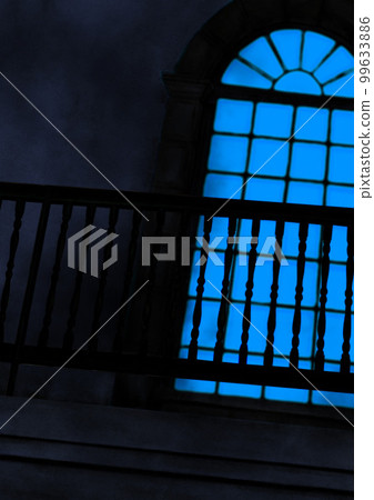 Illustration of a blue shining window and veranda of an old Western-style building 99633886