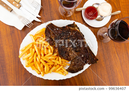 Grilled beef meat with fried potato for dinner Grilled beef meat with fried potato for dinner 99636407