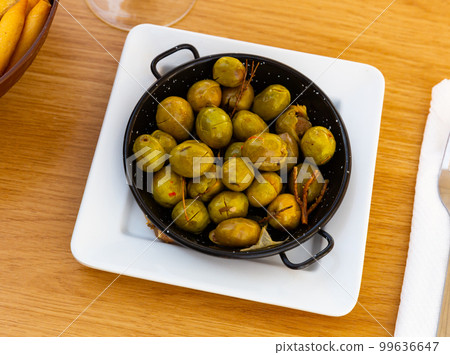 Unpitted brine cured green olives, Spanish tapas 99636647