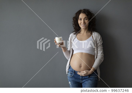 Healthy Drink. Portrait Of Beautiful Pregnant Female Holding Glass Of Milk 99637246
