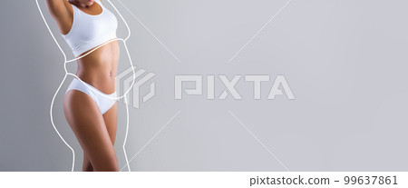 Young slim black female in white lingerie enjoys weight loss result with abstract fat body around Young slim black female in white lingerie enjoys weight loss result with abstract fat body around 99637861