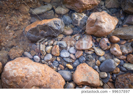 Rocky shapes on the beach. textures and patterns generated on the stones of the Ibiza. 99637897