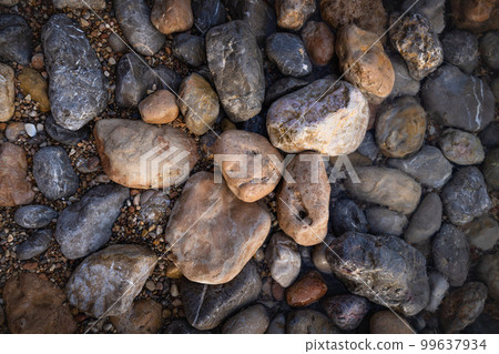 Rocky shapes on the beach. textures and patterns generated on the stones of the Ibiza. Rocky shapes on the beach. textures and patterns generated on the stones of the Ibiza. 99637934