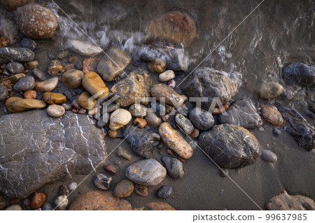 Rocky shapes on the beach. textures and patterns generated on the stones of the Ibiza. Rocky shapes on the beach. textures and patterns generated on the stones of the Ibiza. 99637985