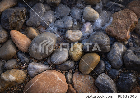 Rocky shapes on the beach. textures and patterns generated on the stones of the Ibiza. 99638009
