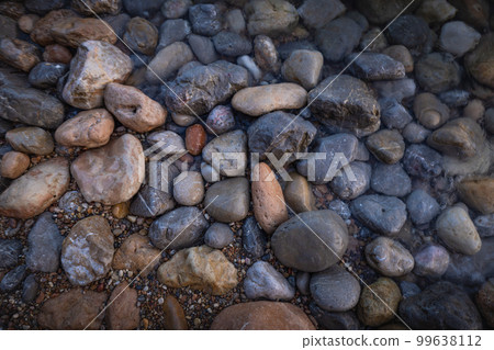 Rocky shapes on the beach. textures and patterns generated on the stones of the Ibiza. 99638112